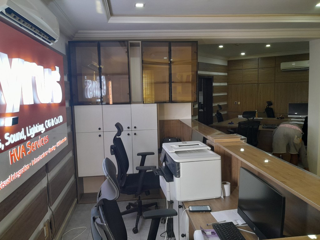 Elegant office reception area with branded desk and warm lighting
